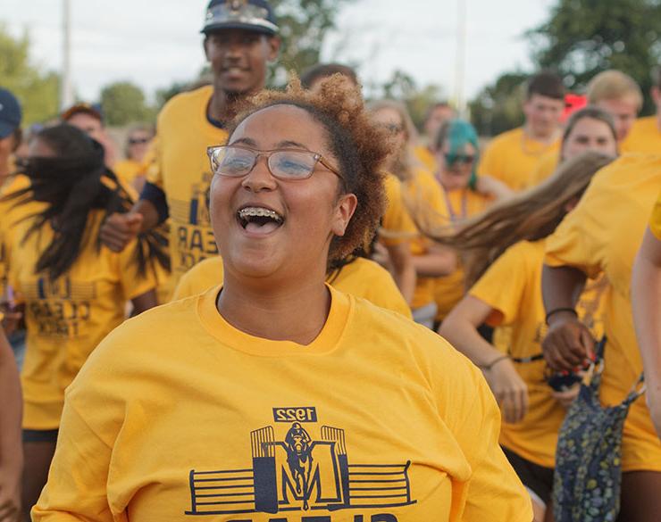 Student smiles at Gold Rush